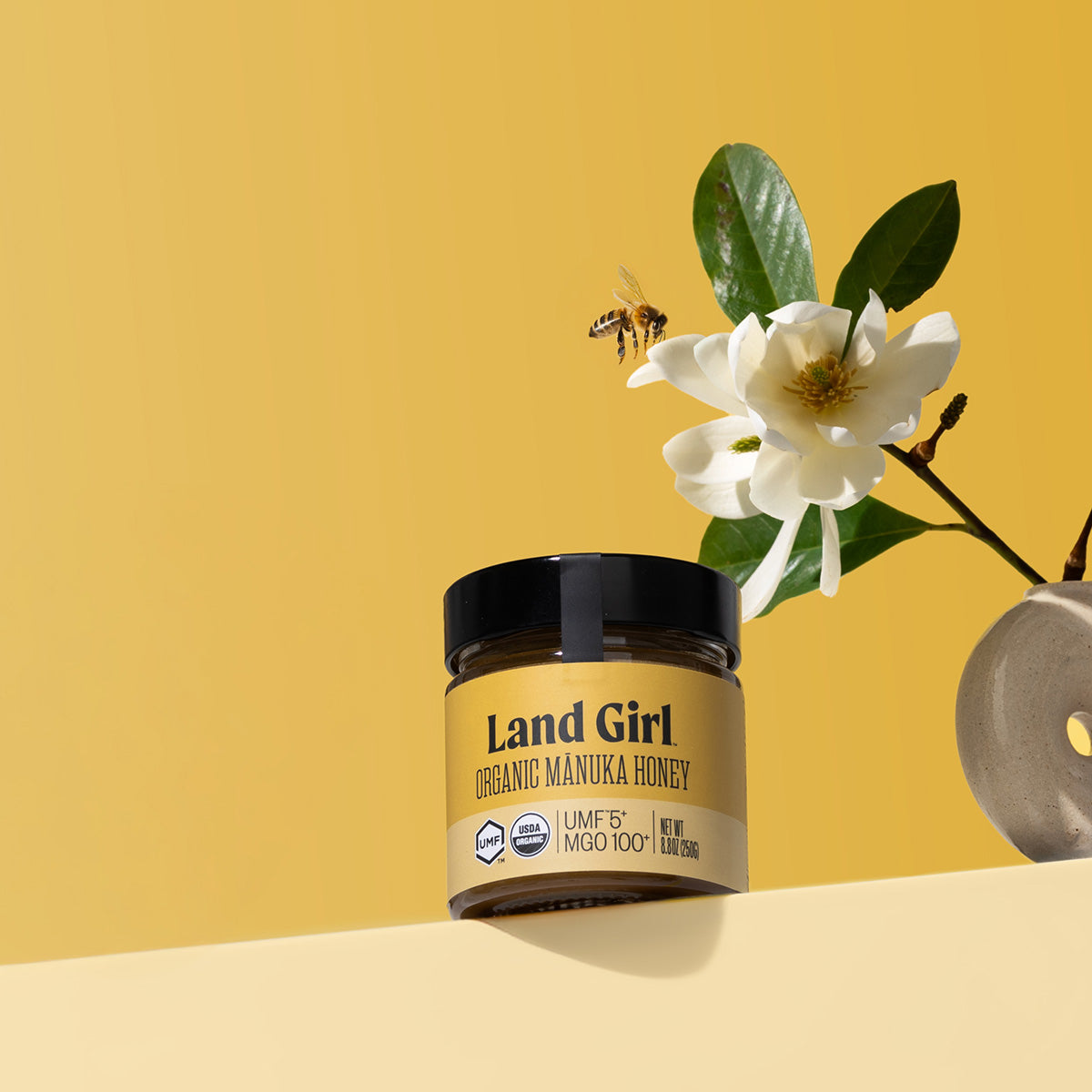 A jar of Land Girl Organic Mānuka Honey.